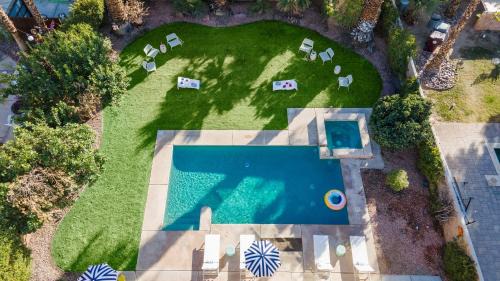Bermuda Dunes House | Pool Hot Tub Yard Games Chic Midcentury Design Painted Sand by AvantStay