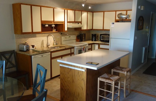 Huddleston House | Power down as hot tub, kayaks, and pool table await, water "footsteps away".
