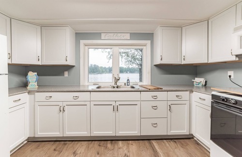 Gladwin House | Pratt Lake Peninsula: Beach Days, Dock Jumps, and Bonfires—Your Summer Escape