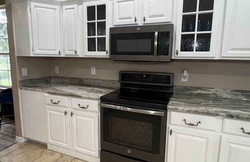 Eustis House | Prepared to be impressed! Welcome home! 7 bedroom 4 bathroom with HEATED pool!
