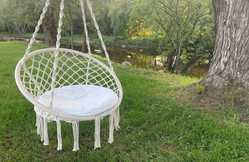 Babcock House | Relax by the river in this 4 bedroom house with firepit- spot our river eagle!