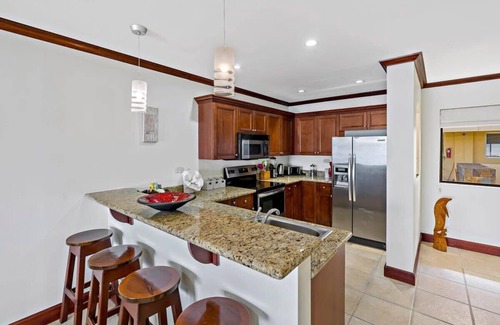 Playa Flamingo Condo | Remodeled Top-Floor Condo with Stunning Wrap-Around Balcony Offering Mountain, O