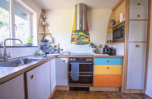 Treator House | Seaside House. Large living area opens onto elevated lawn. 2 mins walk to beach