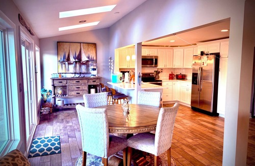 Portage Lakes Cottage | SLICE OF HEAVEN lake front cottage with HOTTUB, fire pit, kayaks & Dog friendly!