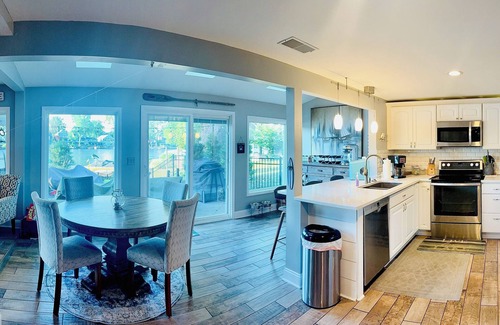Portage Lakes Cottage | SLICE OF HEAVEN lake front cottage with HOTTUB, fire pit, kayaks & Dog friendly!