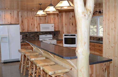 Park Rapids Resort | Spruce with two story high windows with loft on the premier lake of Big Sand