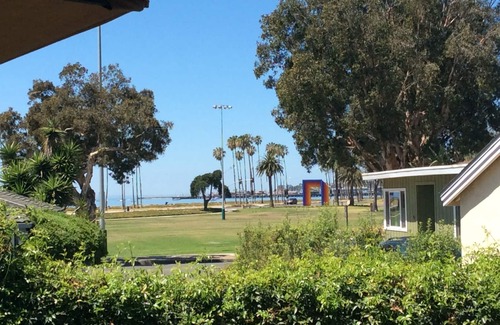 East Beach Cottage | Steps to the Sand: Enjoy beach views & a private fenced yard. Great for families
