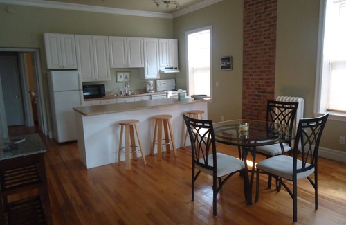 Queens Square Apartment | Stylish Downtown Historic District Suite Near Water Front & Convention Centre