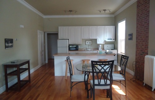Queens Square Apartment | Stylish Downtown Historic District Suite Near Water Front & Convention Centre