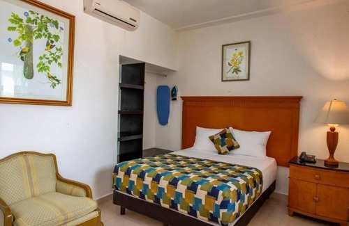 Centro Hotel | Sun-Soaked Mérida Single Room Stay: Outdoor Pool, Courtyard & Relaxing Comfort