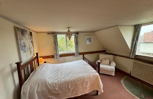 Cheveley House | Thatched Cottage - with dog Poppy