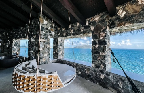East End Apartment | Top‑Level Sunrise Oceanview Suite, Private Balcony
