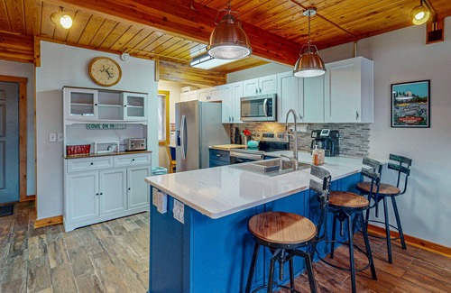 Sunplace House | Tranquil & sunlit lake retreat with pool, fire pit, & views - near skiing & golf