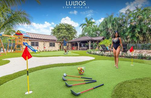 Golden Glades Villa | TropiCasa Paradise Near Beach-Downtown with Heated pool Mini Golf & BBQ L22