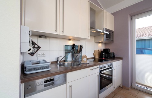 Pelzerhaken House | Vacation home close to the beach for 4 people and dog with sauna, fireplace and fenced garden.