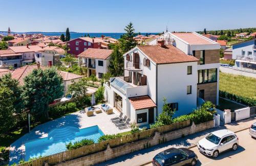 Fazana Villa | Villa Andrija Family Dream with heated pool at the sea with beautiful garden, outside cinema and kids playground