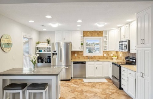 Colington Harbour House | Waterfront! Game Room, Hot Tub, Theater Room, Fire Pit, Kayaks, SUPs,YMCA,DogsOK