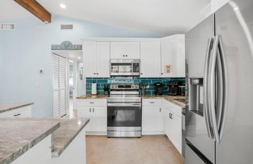 Bahia Vista House | Your Waterfront Family Compound - Free Golf Cart, Paddleboards, Heated Pool