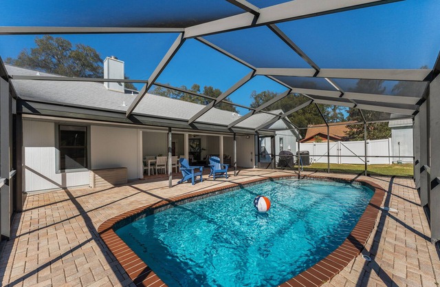 1 acre private retreat with pool, firepit, volleyball, basketball & open concept