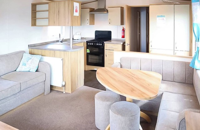 12ft-wide stylish and comfortable caravan with one double and two twin.