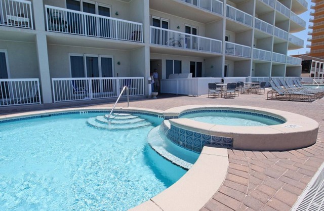 1st FLOOR UNIT - steps to the beach and pool! Book for the Fall season!
