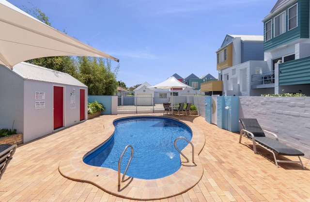 2-Bed Coastal Haven: River Views, Swimming Pool