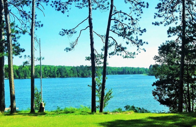 2015 Built Lakeshore Cabin with 220 of shoreline, sandy beach on 8 private acres