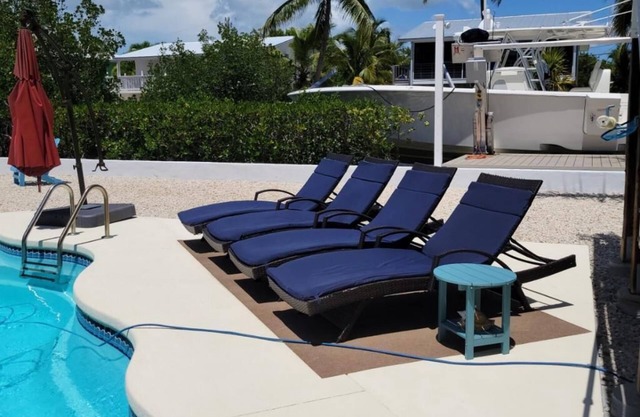 3/2 two story home with pool and 80' dock on canal ocean side.