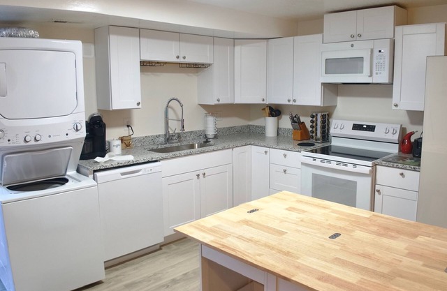 3-bed/2 bath basement apt. in charming Midvale with AC, wifi, laundry & hot tub.