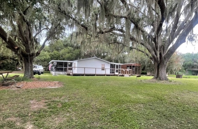 3 bedroom, 2 bath on Lake Kissimmee canal with boat dock and trailer parking.