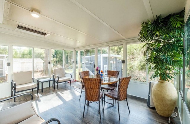 4 bed/2 bath home with a 3-season sunroom with a variety of nice amenities