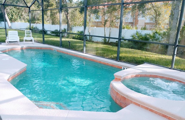 4 bedroom single story house with south facing pool and spa close to Disney