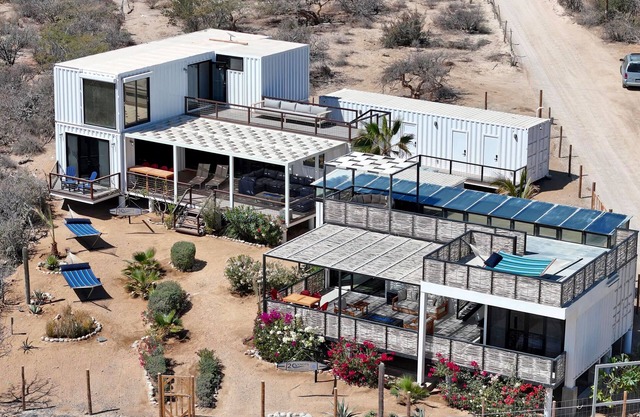 5BR/4BA repurposed shipping containers. Game room w/smart darts, shuffleboard, video games, Infinity board game, new 8 person hot tub, multiple decks w/firepits, fast Wifi (250 mb+)w/Starlink backup. Use of 2 SUPs. Daily housekeeping optional.