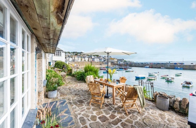A beautifully refurbished stone cottage that sits right on Mousehole Harbour's waters edge.