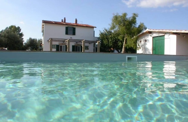 A farm house, situated on a hillock of the Maremma in the Latium