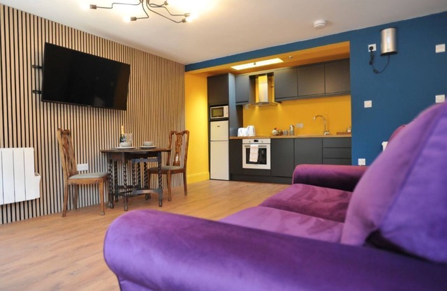 A ground floor studio flat with either double or twin beds, fully equipped kitchen + parking