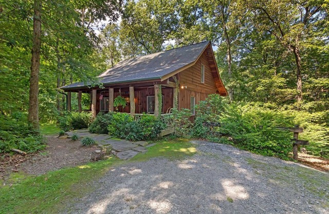 A Laurel Haven, with big porches and a log cabin feel. Fireplace.
