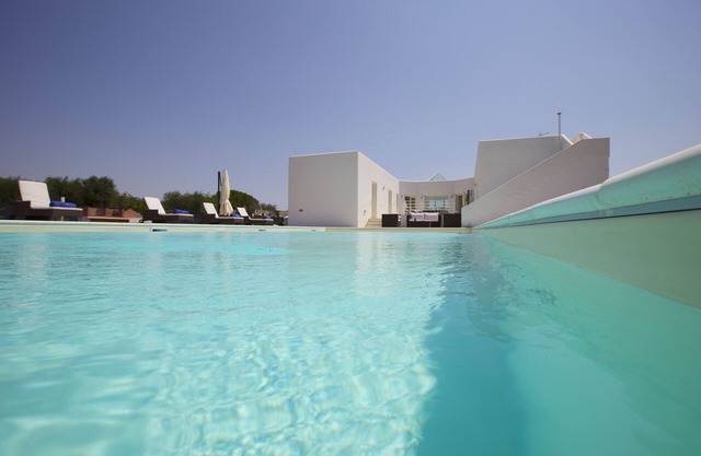 A modern villa set between Sava and Campomarino in a peaceful private setting.