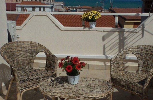 a room in the picturesque village of Le Castella