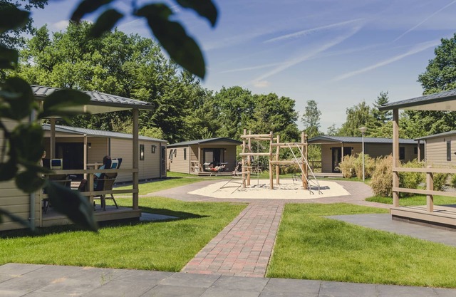 A spacious bungalow with a nice veranda and a view of the playground