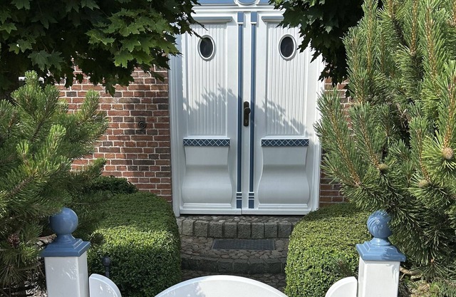 A thatched semi-detached house with parking space for up to 2 cars.