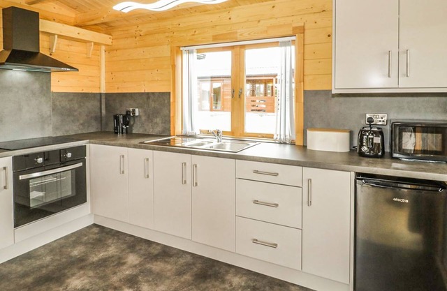 A top quality lodge with stunning views of the Snowdonia mountain range in the distance.