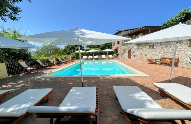 A two floor detached house with a patio/terrace & a large garden