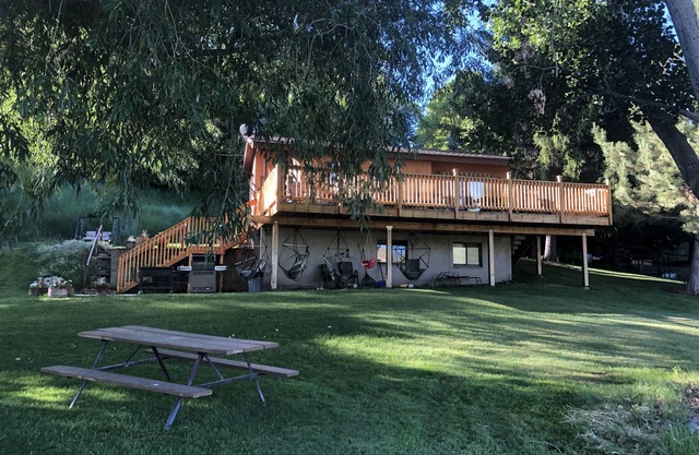 A wonderful, secluded 2 story cabin, deck, fire pit, stocked pond for fishing.