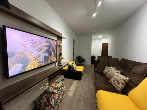 Aconchego no Canto do Forte - Ar Condicionados - Tvs Grandes - Wi-fi e Estacionamento Incluso!