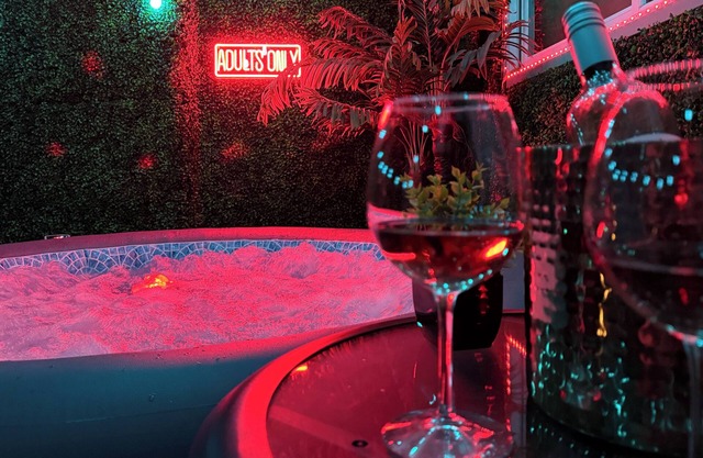 Adult-only fantasy suite with hot tub, dance pole, and kink-inspired furniture. Perfect for couples craving privacy, intimacy, and play. Discreet, clean, and unforgettable—your private Red Chamber escape.