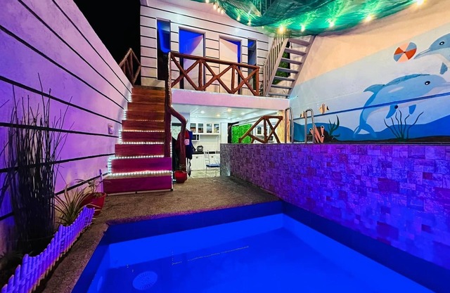 Affordable Cozy rest house with pools , free wifi and parking on site