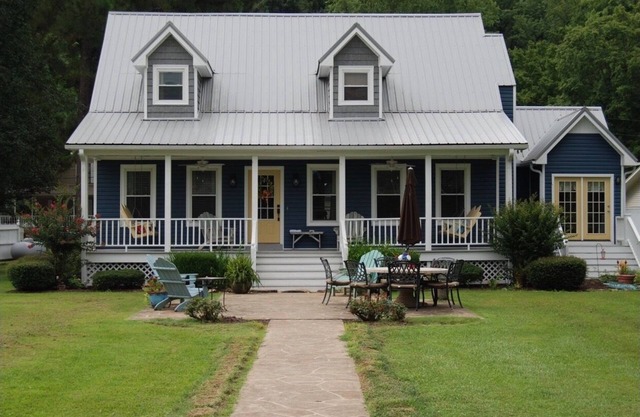 Amazing Lake house with a great yard and boathouse with a party deck.