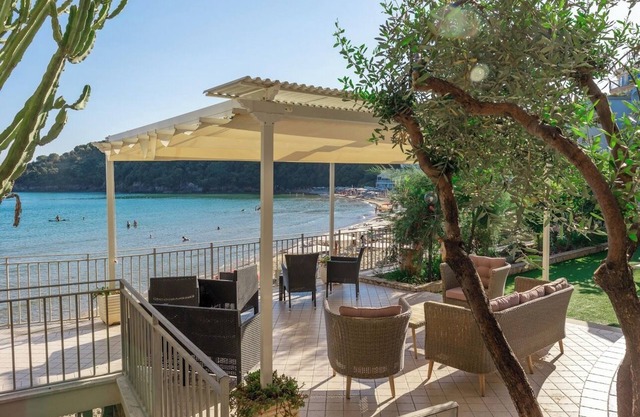 Apartment below with parking and private beach.