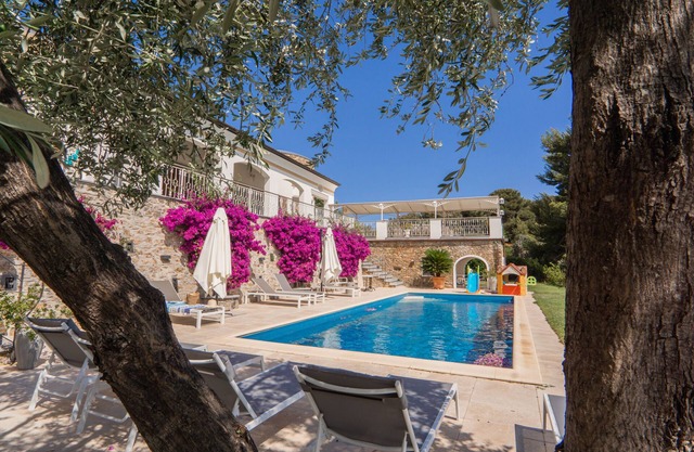 Apartment in a villa with a shared pool.